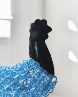 Close up of head detail on cockerel sculpture -