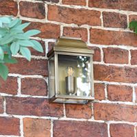 Half Wall Lantern Finished in an Antique Brass Half Wall Lantern Finished in an Antique Brass
