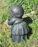 Close up of intricate back detail on garden sculpture