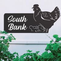 Black Hen & Chicks Iron House Name Sign on a White Wall Black Hen & Chicks Iron House Name Sign on a White Wall