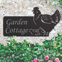 Hen & Chicks Iron House Name Sign in Situ on the Front of a House Hen & Chicks Iron House Name Sign in Situ on the Front of a House