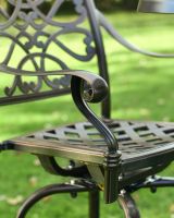 Close up of scroll detailing on chair arm Close up of scroll detailing on chair arm