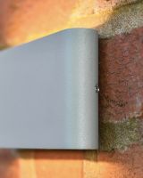 Close up of aluminium detail on garden wall light