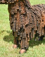 Close up of intricate body detailing on recycled bike chain cow garden sculpture Close up of intricate body detailing on recycled bike chain cow garden sculpture