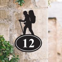 Hiking Iron House Number Sign on a Garden Wall Hiking Iron House Number Sign on a Garden Wall