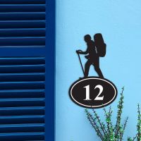 Hiking Iron House Number Sign in Situ on a Blue Wall Hiking Iron House Number Sign in Situ on a Blue Wall