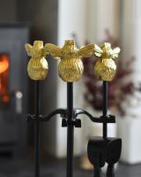 Close up of honeybee handle detail on fireside companion set