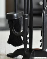 Close up of tools on black fireside companion set