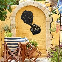 Floating House on Balloons Steel Wall Art on a Yellow Wall Floating House on Balloons Steel Wall Art on a Yellow Wall