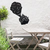 Floating House on Balloons Steel Wall Art above a Wooden Table set Floating House on Balloons Steel Wall Art above a Wooden Table set