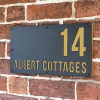 Sand Yellow "Albert" House Sign in Situ on the Wall Sand Yellow "Albert" House Sign in Situ on the Wall