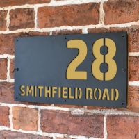 Sand Yellow "Smithfield" House Sign in Situ on the Wall Sand Yellow "Smithfield" House Sign in Situ on the Wall