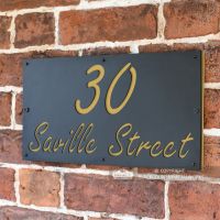 Sand Yellow "Saville" House Sign in Situ on the Wall