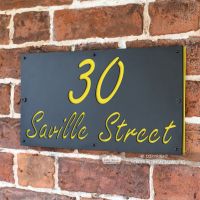 Zinc Yellow "Saville" House Sign in Situ on the Wall Zinc Yellow "Saville" House Sign in Situ on the Wall