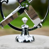 Close up of Bright Chrome Armillary Base