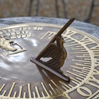 Old Father Time Sundial with bird gnomon Old Father Time Sundial with bird gnomon