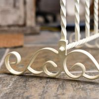 Blacksmith wrought iron foot on boot rack