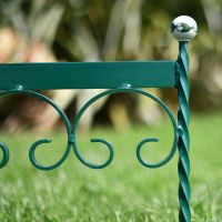 Close up of scrolled hand crafted racing green boot scraper