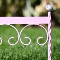 Close up of pink finish boot scraper