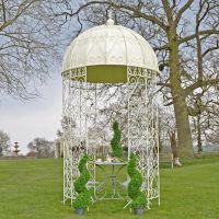 Ornate ironwork gazebo in garden Ornate ironwork gazebo in garden