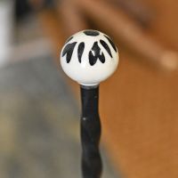 Detailed image of ceramic finial on welly rack Detailed image of ceramic finial on welly rack