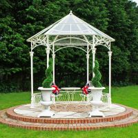 Ornate scroll design gazebo with glass roof