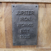 Industrial "Jupiter Iron Works" Plaque on the TV Cabinet