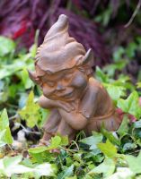 Close-up Cast Iron Sitting Elf Garden Statue