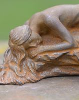 Close-up Cast Iron Sleeping Woman Sculpture