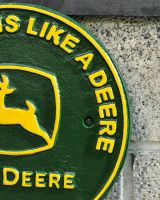 Close up of hand painted detail on cast iron wall sign