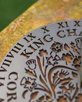 Close-up of the DEtauil on the King Charles III Coronation Garden Sundial Close-up of the DEtauil on the King Charles III Coronation Garden Sundial