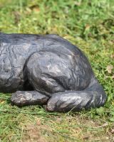 Close up of hind legs on dog garden sculpture