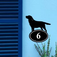 Labrador Iron House Number Sign on a Blue Wall