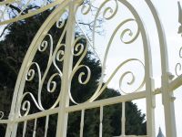 Close up of intricate scrollwork on iron outdoor pavilion