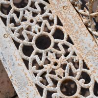 Close up of detailing on cast iron garden bench Close up of detailing on cast iron garden bench