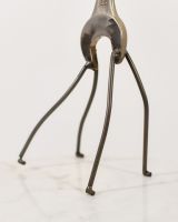 Close up of leg detail on recycled metal art sculpture Close up of leg detail on recycled metal art sculpture