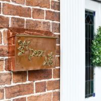 "Drustan" Copper and Brass Celtic Design Post Box in Situ on a Wall "Drustan" Copper and Brass Celtic Design Post Box in Situ on a Wall