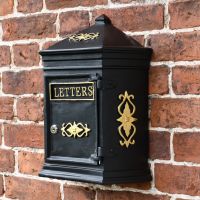 Traditional postal box on brick wall Traditional postal box on brick wall