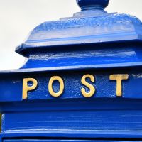 Close up of gold lettering on "POST" 
