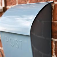 Close up of curved post box top Close up of curved post box top