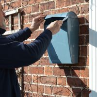 light grey contemporary post box with lid up