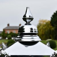 Close up of polished nickel finial 