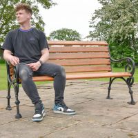 Brown "Vine" Garden Bench with male for scale 