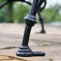 Close up of cast iron leg on garden bench 