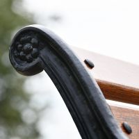 Close up of floral finial within cast iron frame