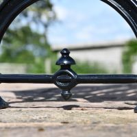 Close up of decorative embellishment under curved leg  Close up of decorative embellishment under curved leg