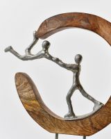 Close up of silver cast aluminium figures on home decor sculpture Close up of silver cast aluminium figures on home decor sculpture