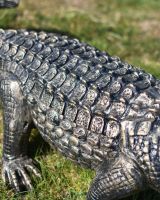 Close-Up of Life-Size Cast Aluminium Crocodile Garden Sculpture in Situ