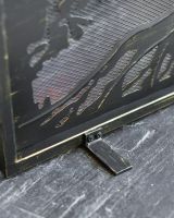 Close Up Of "Lignum Vitae" Brushed Gold Fire Guard Feet Close Up Of "Lignum Vitae" Brushed Gold Fire Guard Feet