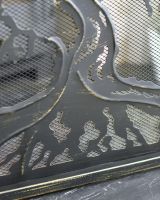 Close Up Of "Lignum Vitae" Brushed Gold Fire Guard Texture Close Up Of "Lignum Vitae" Brushed Gold Fire Guard Texture